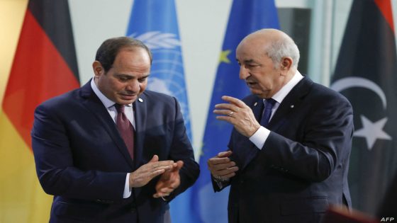 Egyptian President Abdul Fattah al-Sisi (L) and Algerian president Abdelmadjid Tebboune talk before posing for a family picture during a Peace summit on Libya at the Chancellery in Berlin, on January 19, 2020. - World leaders gather in Berlin on January 19, 2020 to make a fresh push for peace in Libya, in a desperate bid to stop the conflict-wracked nation from turning into a "second Syria". Chancellor Angela Merkel will be joined by the presidents of Russia, Turkey and France and other world leaders for talks held under the auspices of the United Nations. (Photo by Odd ANDERSEN / AFP)